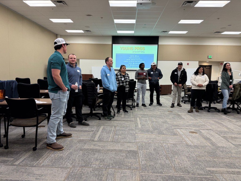 A group of young pros standing together in a circle