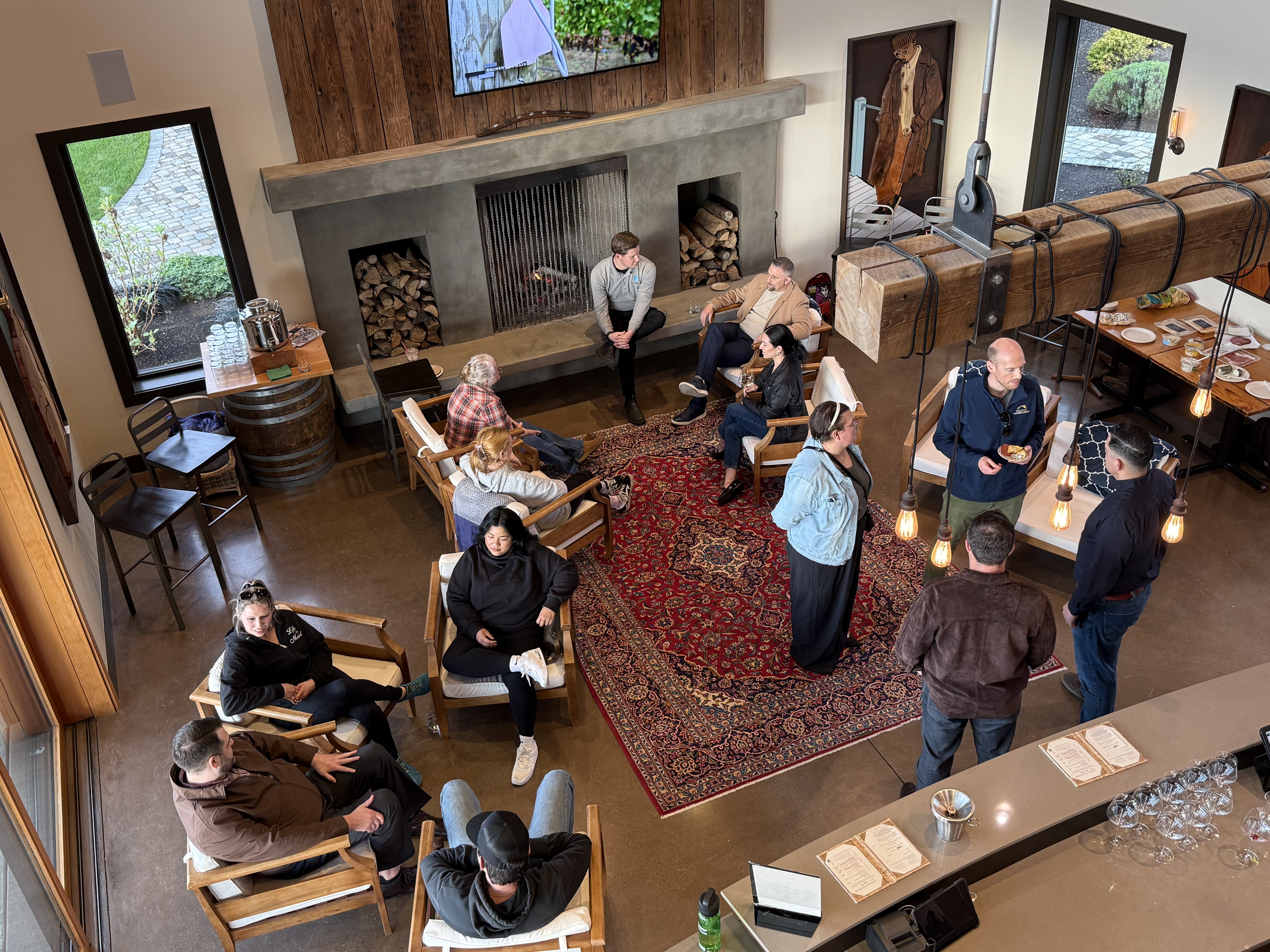Young pros networking event, people standing around a winery