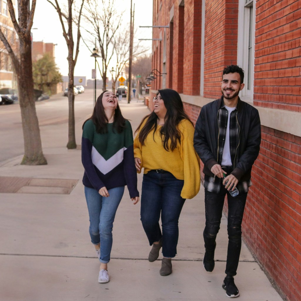 A group of young professional walking together down the street