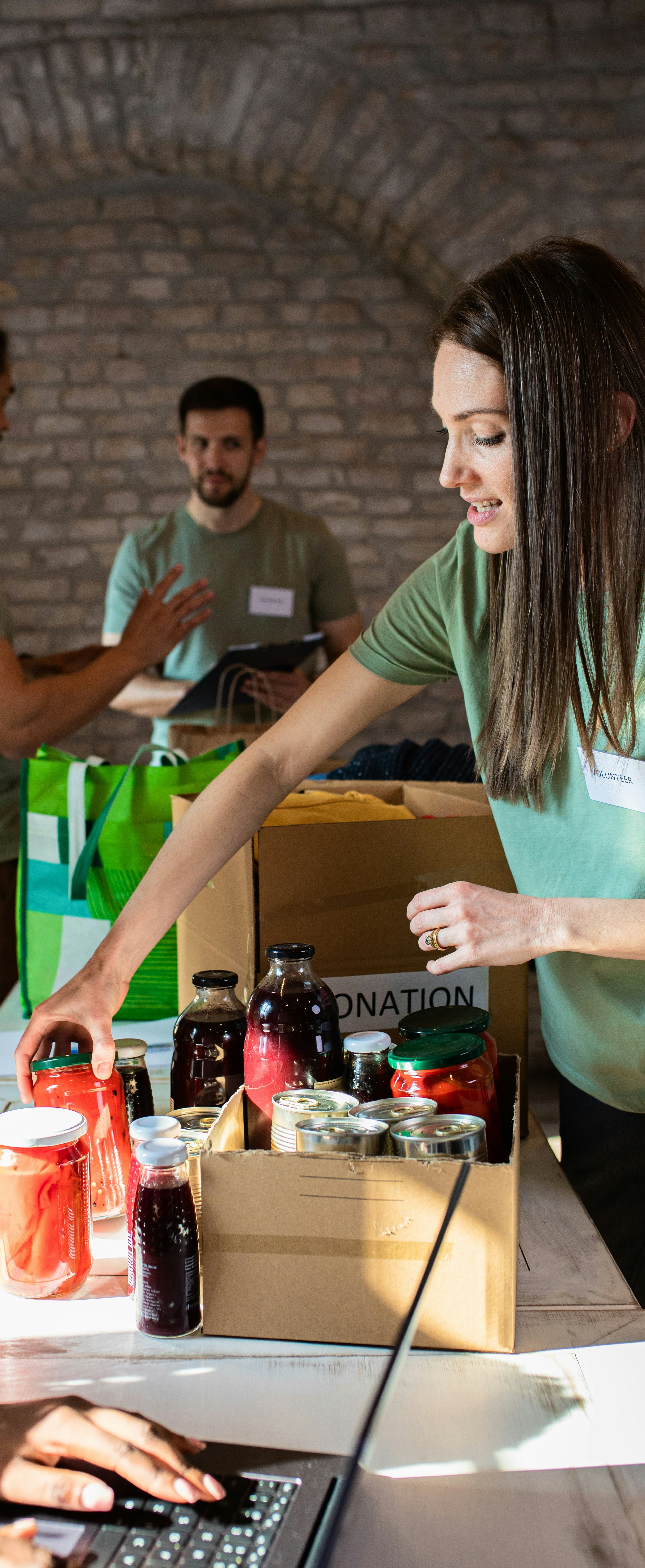 An image of a people sorting donations into boxes