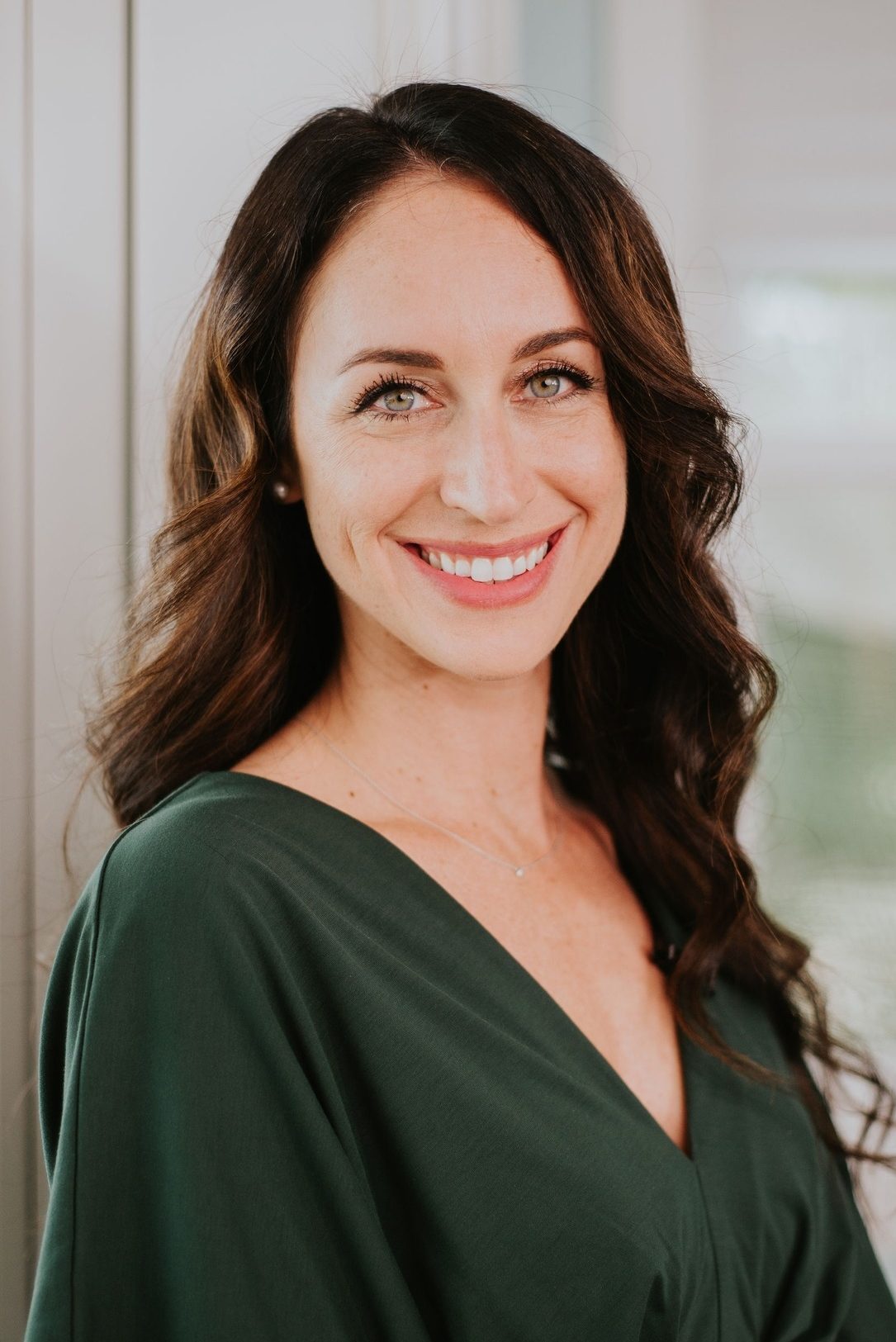 A headshort of Cortney Kaveh owner of NW Money Coaching